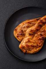 Delicious fresh grilled chicken fillet with spices and herbs