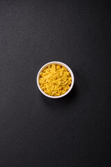 Delicious boiled yellow rice with turmeric, salt and spices