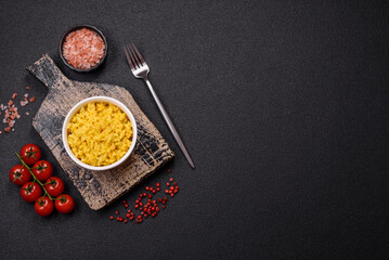 Delicious boiled yellow rice with turmeric, salt and spices