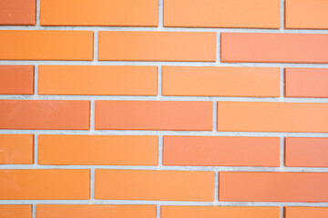 Obraz premium Brick wall of red color, wide panorama of masonry,Red brick wall texture background,brick wall texture for for interior or exterior design backdrop.copy space, brickwork exterior mockup.