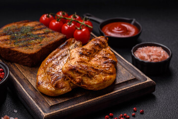 Delicious fresh grilled chicken fillet with spices and herbs