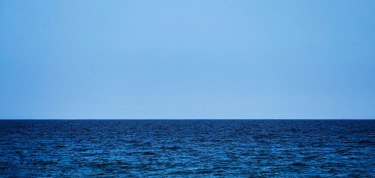 summer background of blue sea and blue sky of a beautiful day of august in italy in 2024