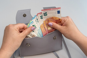 female hand hold paper euro bills, concept of acount money