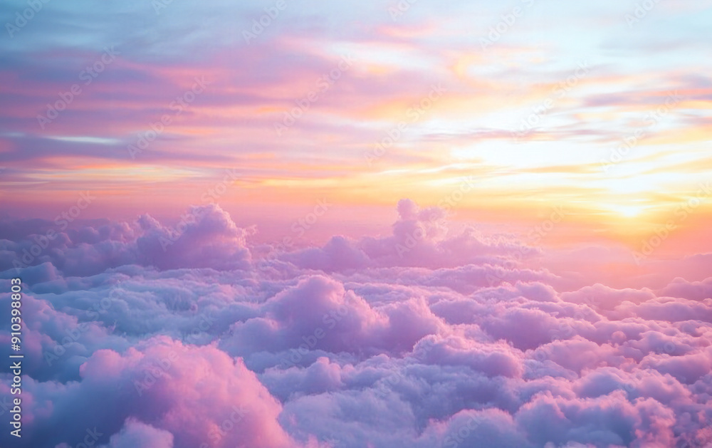 Wall mural Beautiful sunset sky with pink fluffy clouds view from above