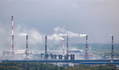Fototapeta premium Air pollution smog from power factory plant chimneys smoking pipe sunset. Concept industry environmental problems.