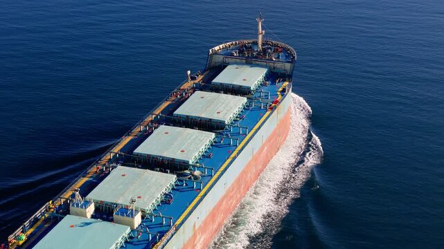 Bulk cargo carrier ship underway in sea. Dry cargo vessel merchant ship to transport bulk cargo such as grains ore coal