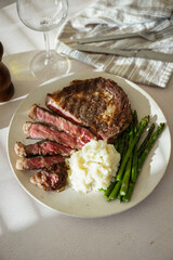 ribeye steak with asparagus and mushed potato