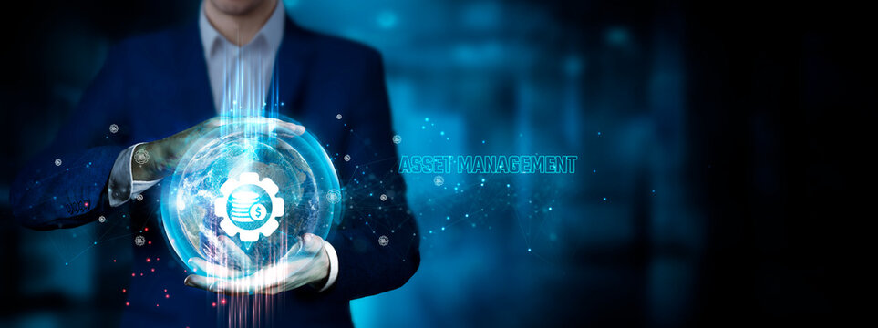 Asset Management: Businessman holding innovation technology to develop smart solutions from digital interfaces, optimization, resource allocation.
