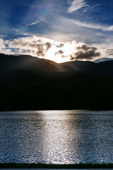 Angkaew lake Reservoir landscape with Doi Suthep mountains background at sunset