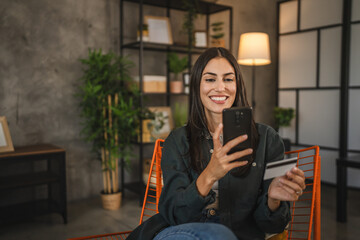 Adult woman enjoy buy online with credit card on mobile phone at home