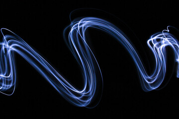 Long exposure photograph - Light Painting Photography - swirly waves of neon white light against a black background