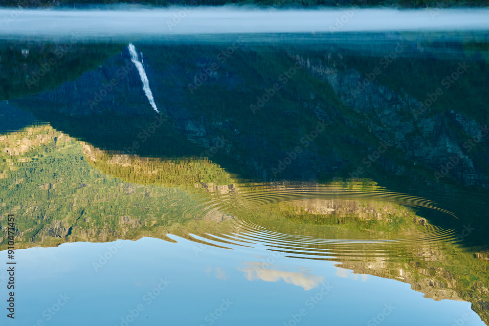 Wall mural Reflections of the Eidsvatnet Lake, Skjolden, Sogn og Fjordane, Norway, of July 2024. Aasafossen Waterfall  is reflected in the upper left.