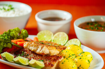 fish fillet with vegetables and boiled soute potatoes.