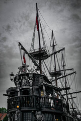 Ghosty flying dutchman ship and stormy sky
