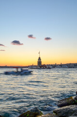 maiden tower and a boat  in the bosphorus, istanbul