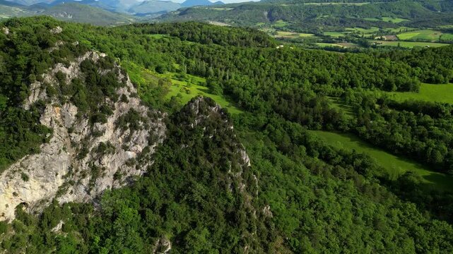 Panoramic mountain view near the village of Saou in the Drome department in France of the Vercors hills, the marly hills and the Val de Drome valley. The Saou forest and the 3 peaks - Drome Valley