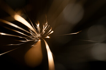 sparks from the grinder glowing in the dark