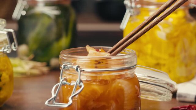 Close-up of fermented spicy cabbage kimchi with in can. Preservation of vegetables in glass jars. Fermentation preserved kimchi cabbage with spices. Asian cuisine.