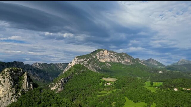 Panoramic mountain view near the village of Saou in the Drome department in France of the Vercors hills, the marly hills and the Val de Drome valley. The Saou forest and the 3 peaks - Drome Valley