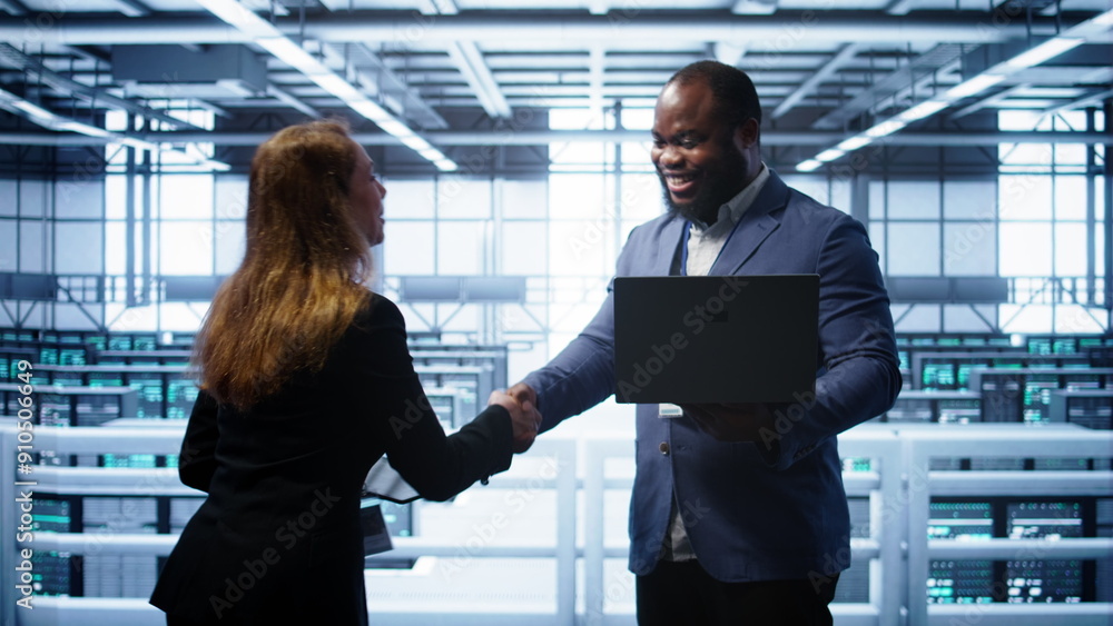 Poster african american admin greeting inspector arriving in data center to supervise operations. it expert
