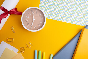 Back to school concept with bright school supplies on colourful background. Flat lay, top view, copy space
