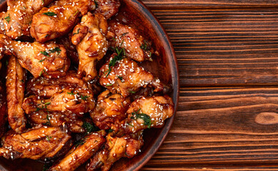 Caramelized in sause chicken wings  . Bar-b-q food background photo