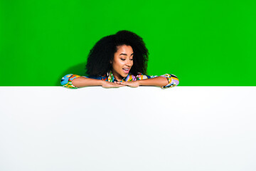 Photo of nice young woman look empty space blank wear shirt isolated on green color background