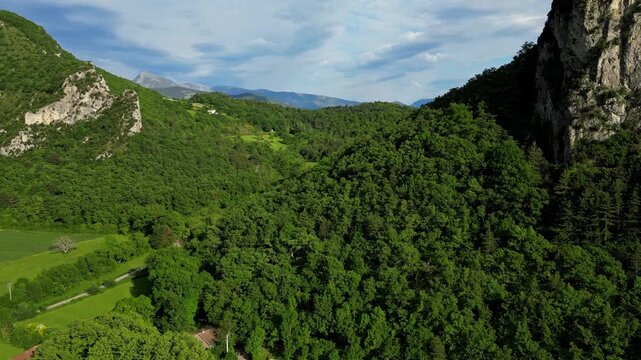 Panoramic mountain view near the village of Saou in the Drome department in France of the Vercors hills, the marly hills and the Val de Drome valley. The Saou forest and the 3 peaks - Drome Valley