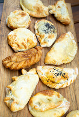 meat, fish, onion empanadas in many varieties, spicy, sweet
