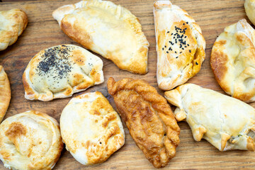 meat, fish, onion empanadas in many varieties, spicy, sweet
