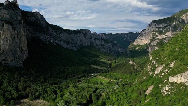 Panoramic mountain view near the village of Saou in the Drome department in France of the Vercors hills, the marly hills and the Val de Drome valley. The Saou forest and the 3 peaks - Drome Valley