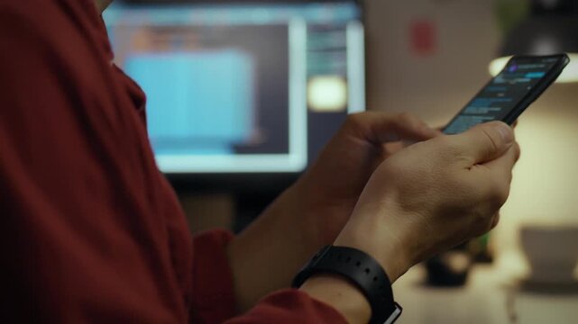 Screen. Worker at home using intelligence focused optimizes code for smartphones in home office. Cinematic frame qualified specialist analyzes visualization data develops neural network, administrator