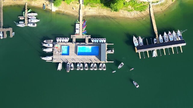 Eco marina on Lake Solina with swimming pool and moored electric boats. Solina lake in Polish Bieszczady Mountains, Poland. Subcarpathian mountains.