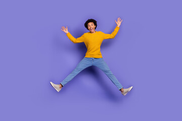 Photo of cheerful positive man wear trendy yellow clothes have fun isolated on purple color...