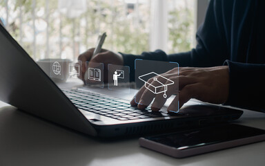 E-learning education concept. Businessman using a laptop computer to webinar online, education on...