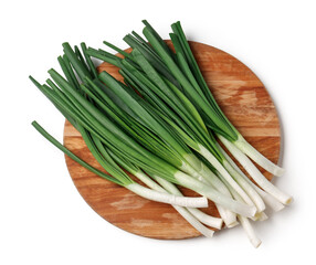 Wooden board with fresh green onion on white background