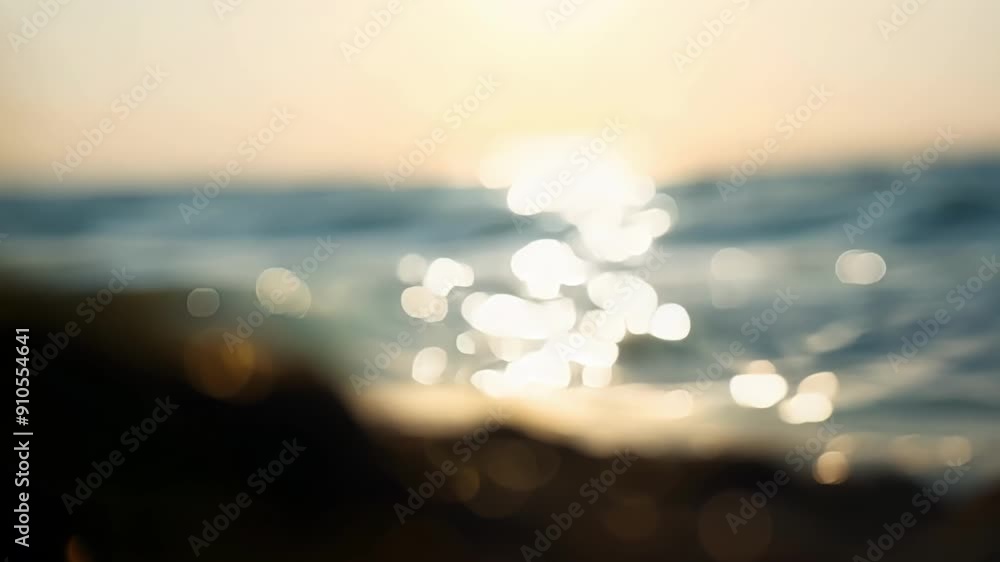 Poster as the day comes to an end the ocean is bathed in the soft light of the setting sun with gentle wave