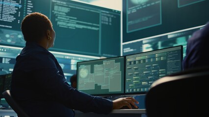 Cyber security expert working on encryption and IT security in a governmental agency. Woman...