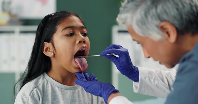 Depressor, kid and pediatrician check tongue for wellness, test or healthcare of people in medical hospital. Child, ent nurse or throat exam of girl for mouth, tonsils or otolaryngology with patient