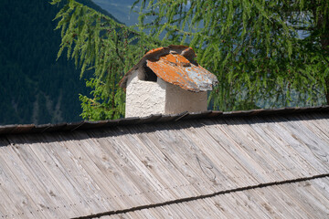 wood tile roof, a typical tradition of many mountain places due to the abundance of natural material. nailing makes them more solid tiles for snow and ice loads.