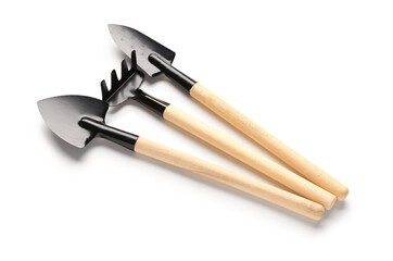 Shovel, spade and rake on white background. Wooden gardening tools