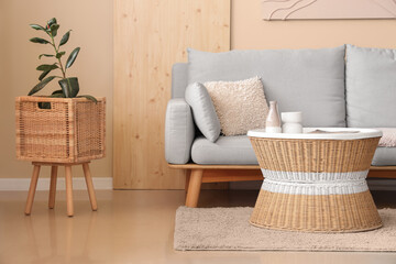 Stylish interior of living room with comfortable sofa and coffee table