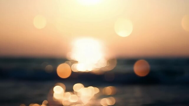 The setting sun casts a warm and dreamy light over the ocean with bokeh dots tered across the sky like stars in a painting. Light leaks bokeh