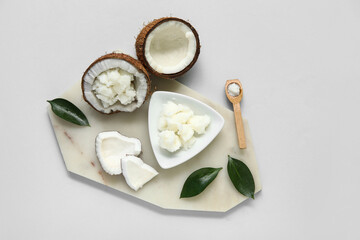 Stone tray and bowl with natural coconut oil on white background