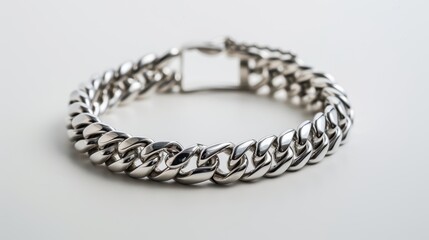 Thick silver chain bracelet is laying flat on a white background, showing its weight and craftsmanship