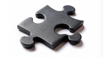 Obraz premium Isolated black puzzle piece on a white background, showcasing intricate details and texture, symbolizing problem solving, strategy, and critical thinking in a minimalist composition.