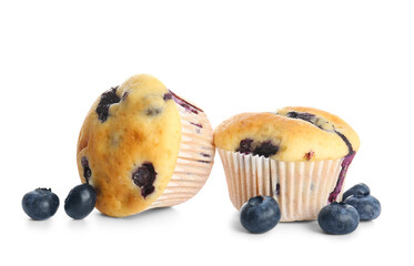 Tasty blueberry muffins on white background, closeup