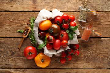 Tomatoes and spices on wooden background. Top view