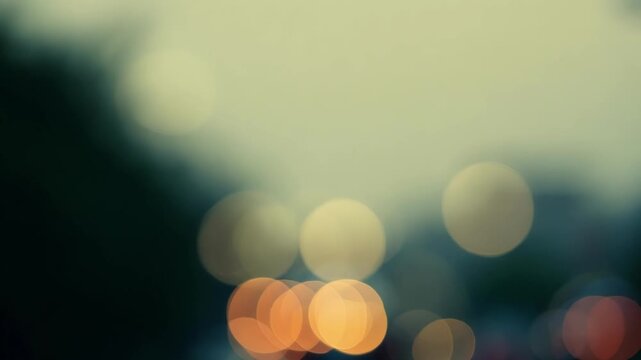 In the midst of a dreary evening the bokeh from streetlights adds a touch of warmth and charm to the cityscape. Light leaks bokeh
