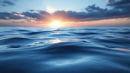Fototapeta premium Sunset over calm ocean waves with partly